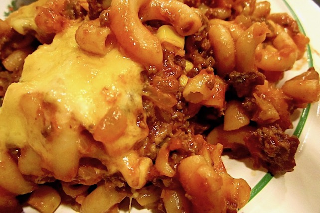 Hamburger and noodle casserole with tomato sauce and spices topped with cheese