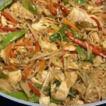 saucy chicken Singapore noodles